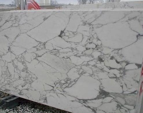 Bianco Carrara – Classic Italian marble with soft gray veins over a white background; timeless and versatile.