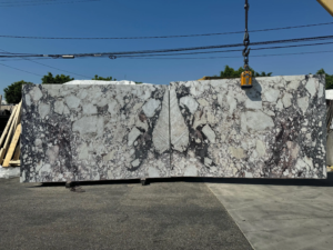 Calacatta Viola – Distinctive white marble with bold violet and burgundy veining; a rare and artistic stone.