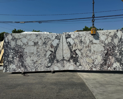 Calacatta Viola – Distinctive white marble with bold violet and burgundy veining; a rare and artistic stone.