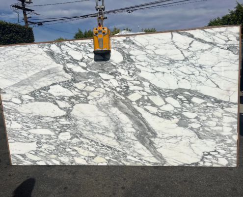 Calacatta Caldia – Pale white marble with subtle gold and gray veins; sophisticated and serene appearance.