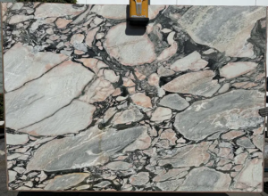 Viola Norte Dame – Dramatic white marble with deep plum and wine-colored veins; bold and luxurious centerpiece stone.