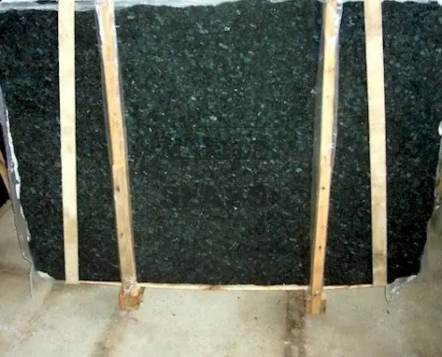 Peacock Green Granite Slab – deep green granite with iridescent mineral highlights