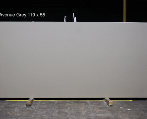 119 x 55 slab. Smooth light gray quartz for clean minimal spaces and neutral kitchen designs.