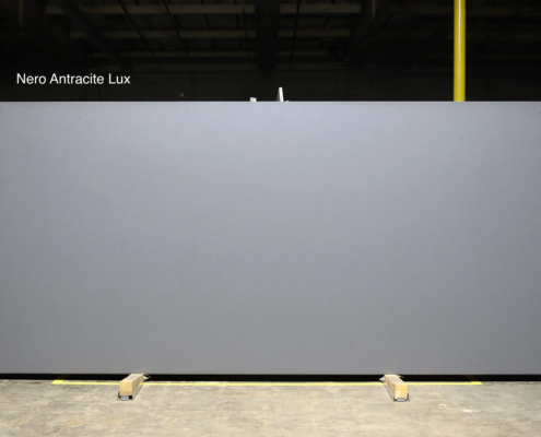 Dark charcoal quartz with a sleek solid look for modern kitchens, bold islands, and high-contrast designs.