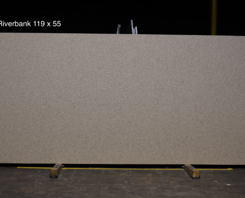 119 x 55 slab. Warm beige speckled quartz for neutral kitchens, bath vanities, and durable everyday countertop use.