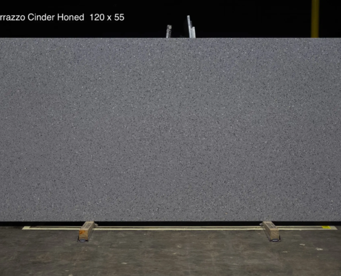 120 x 55 slab. Dark gray terrazzo-look quartz with a honed finish for modern kitchens and commercial-inspired spaces.