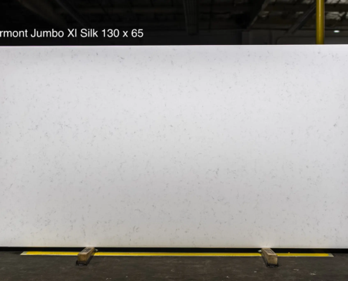 130 x 65 slab. Soft white quartz with subtle movement for elegant kitchens and bright upscale countertop projects.