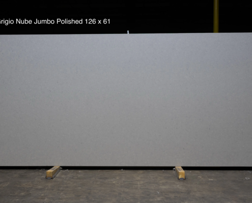 126 x 61 slab. Smooth light gray quartz with a polished finish for clean contemporary countertops and oversized layouts.